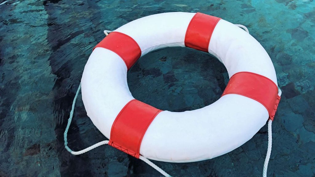 Life preserver floating in water symbolizing support during heroin addiction recovery.