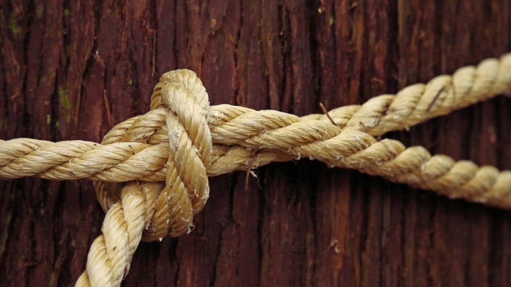 Close up of a knotted rope representing tension and the challenges of opioid relapse.