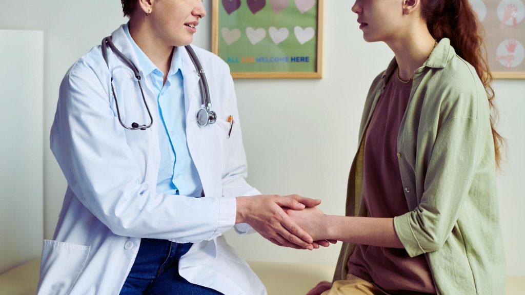 Healthcare provider offering support during an opioid use or pain management conversation.