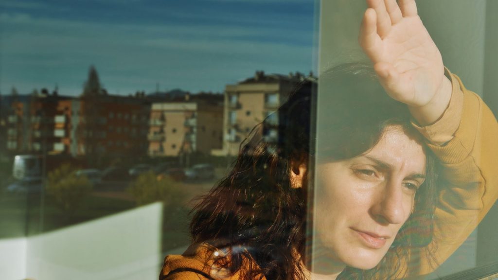 Person showing emotional distress linked to signs of heroin addiction