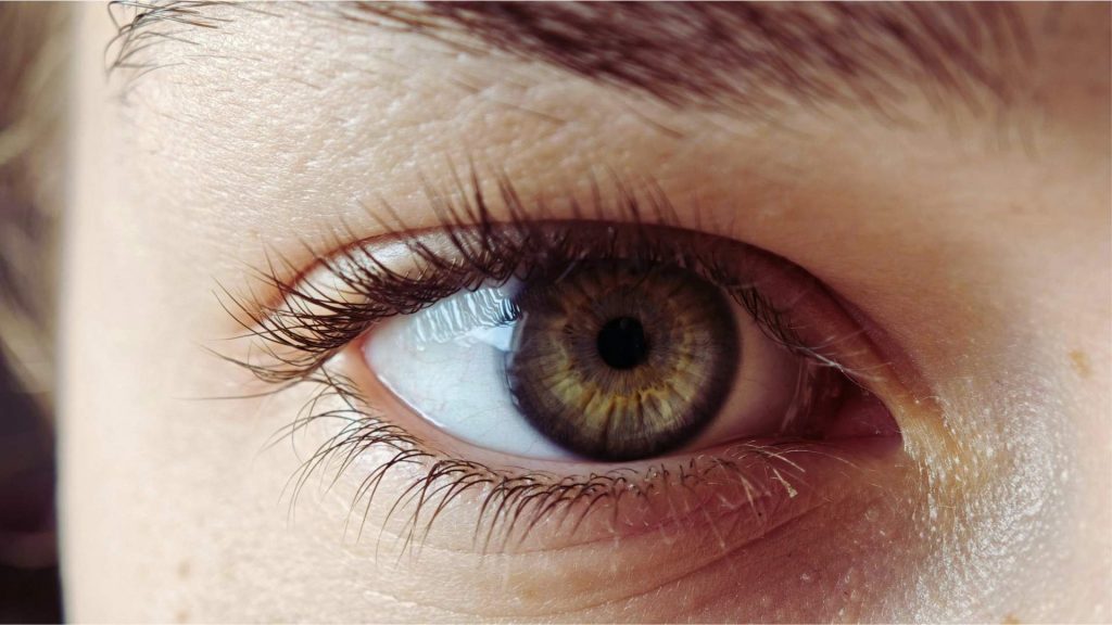 Close-up of an eye showing constricted pupil, a common sign of heroin use.