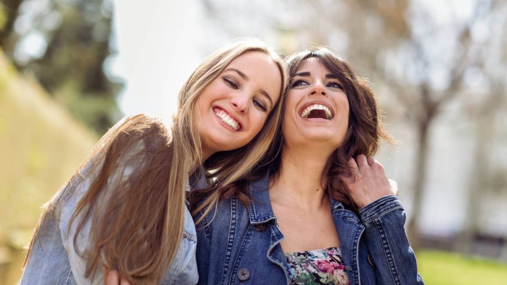 Close friends reconnecting while rebuilding relationships after addiction.