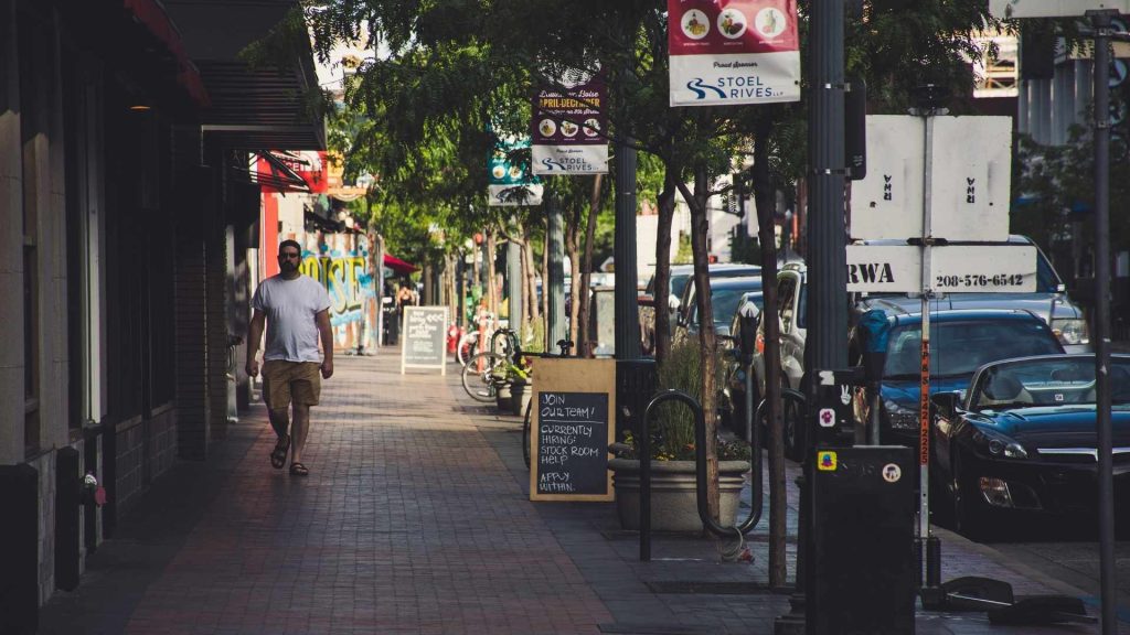 Man walking in Boise representing residency requirements for Medicaid eligibility