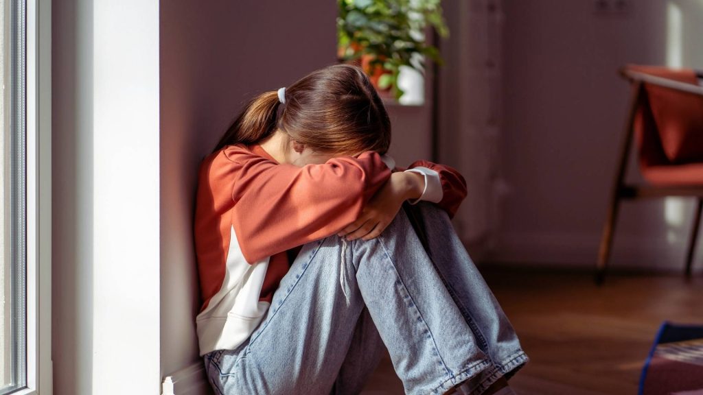 Teen experiencing emotional distress from family addiction stress