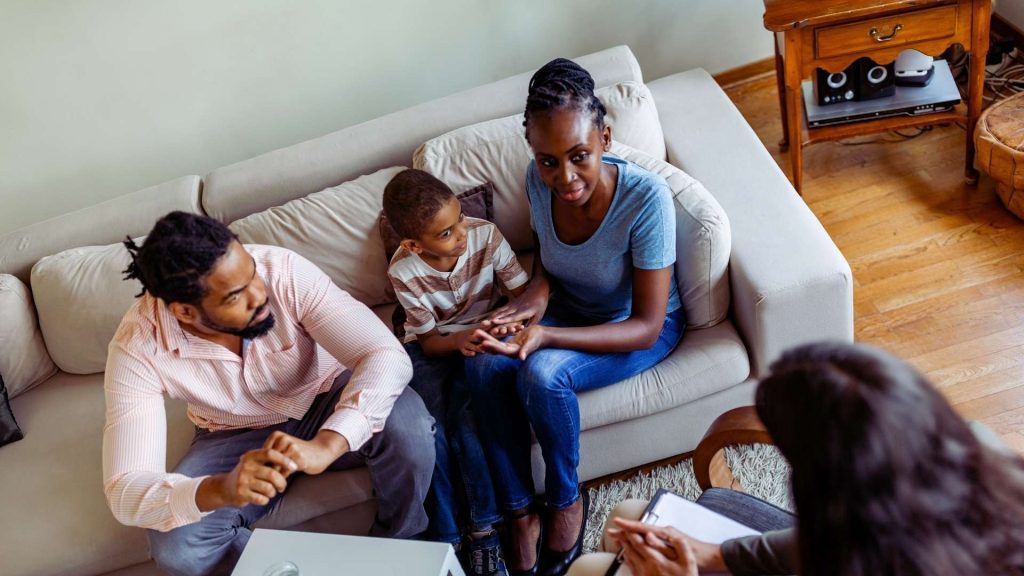 Family participating in addiction treatment session together